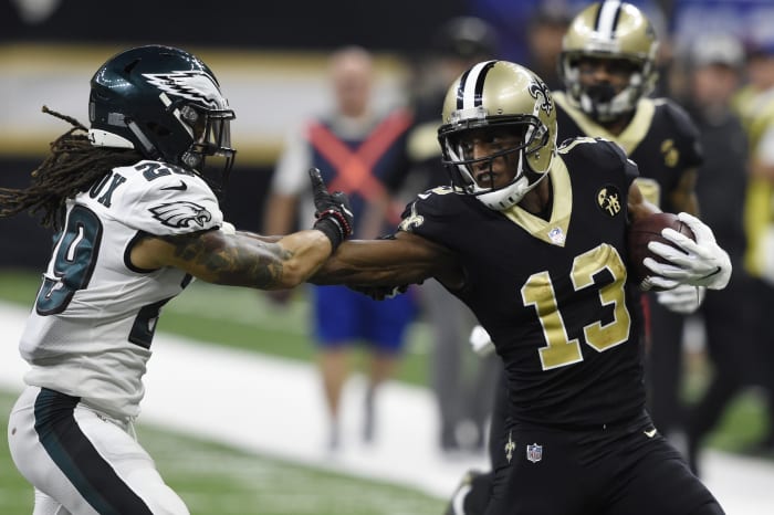 New Orleans Saints receiver Michael Thomas (13) stiff arms Philadelphia Eagles safety Avonte Maddox (29). Mandatory Credit: John David Mercer-USA TODAY Sports